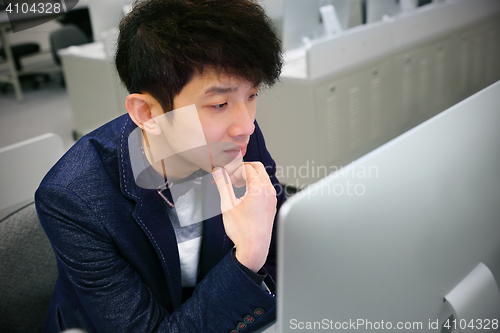 Image of asian man thinking