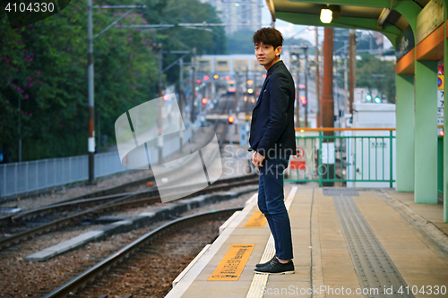 Image of Asia man waiting train
