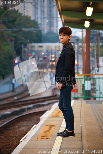 Image of Asia man waiting train