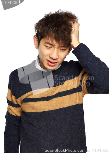 Image of Closeup portrait, stressed young asian man, hands on head with b