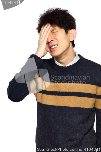 Image of Closeup portrait, stressed young asian man, hands on head with b