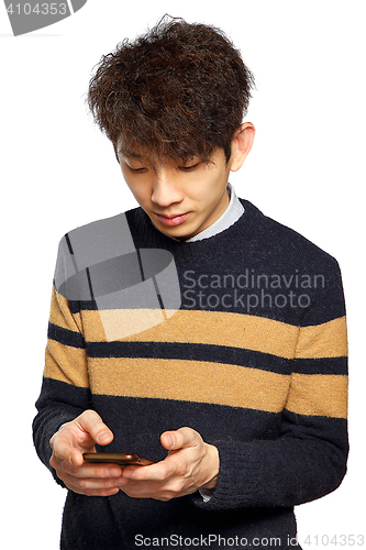 Image of young asia man texting on mobilephone