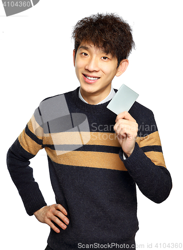 Image of Asian young man holding card