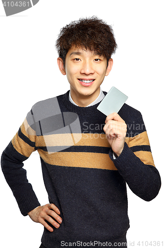 Image of Asian young man holding card