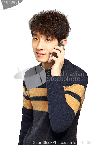 Image of Happy young man talking on mobilephone