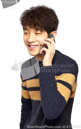 Image of Happy young man talking on mobilephone