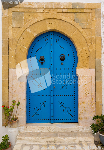 Image of Old Blue door with arch from Tunisia