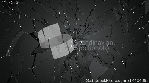 Image of Pieces of splitted or cracked glass on black