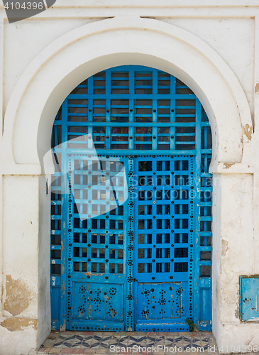 Image of Blue aged door with ornament from Sidi Bou Said in Tunisia