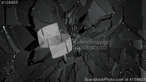 Image of Pieces of splitted or cracked glass on black