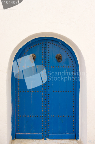 Image of Blue door with arch from Tunisia