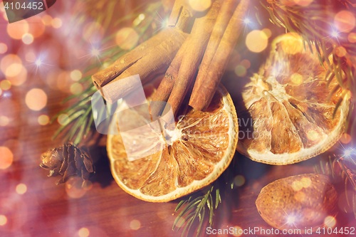 Image of christmas fir branch, cinnamon and dried orange