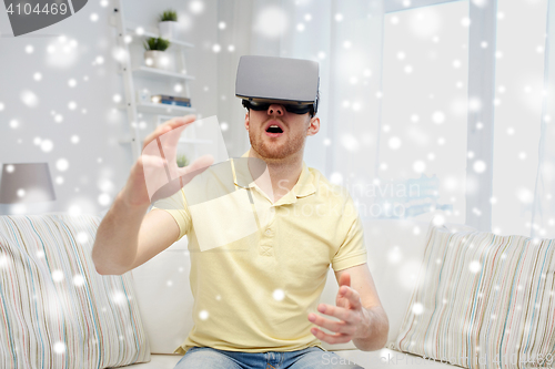 Image of young man in virtual reality headset or 3d glasses