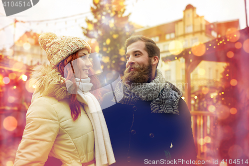 Image of happy couple walking in old town