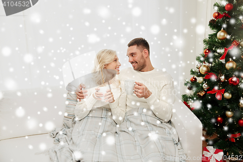 Image of happy couple at home with christmas tree