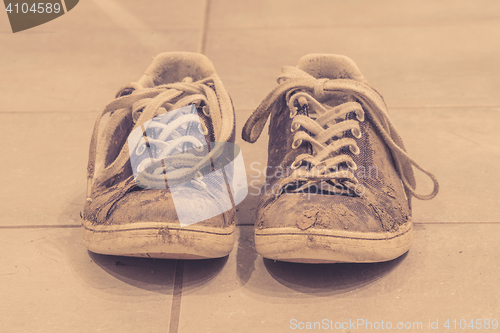 Image of Muddy shoes in sepia color