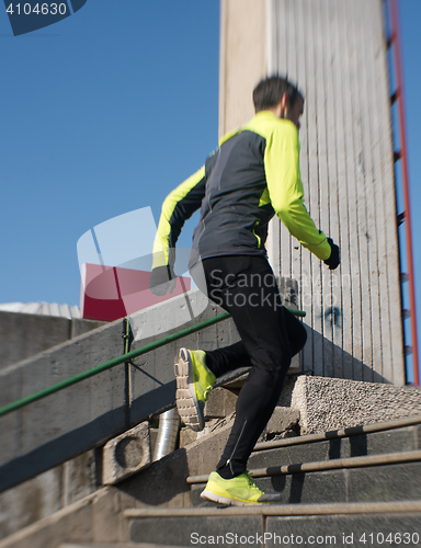 Image of man jogging on steps