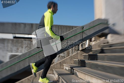 Image of man jogging on steps