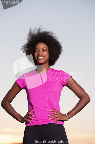 Image of Portrait of a young african american woman running outdoors