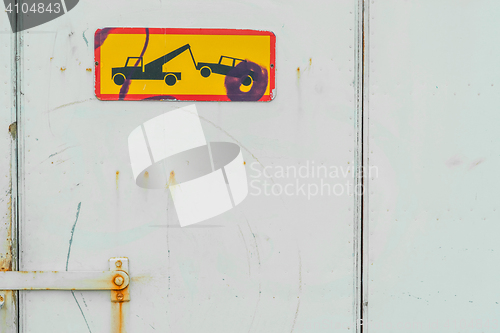 Image of Car removal sign on a port