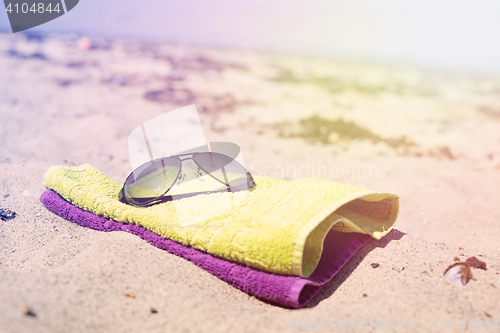 Image of Beach towels with sunglasses