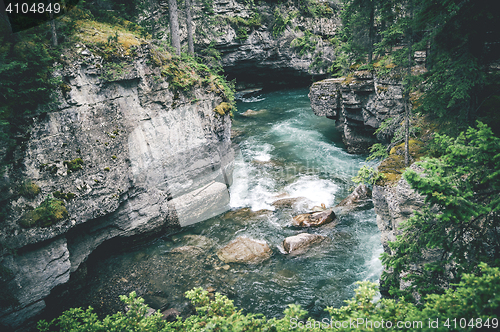Image of Wild river stream among cliffs and rocks