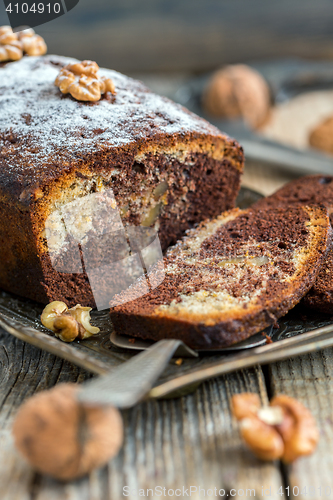 Image of Homemade chocolate cake with walnuts and orange zest.