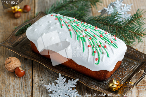 Image of Almond cake with Christmas decorations.