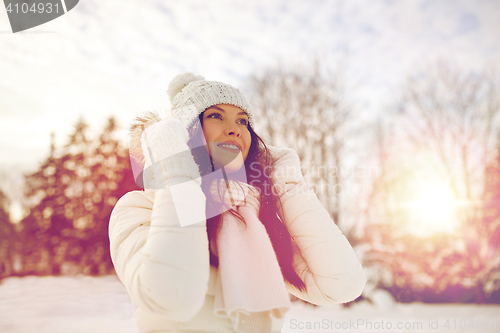 Image of happy woman outdoors in winter