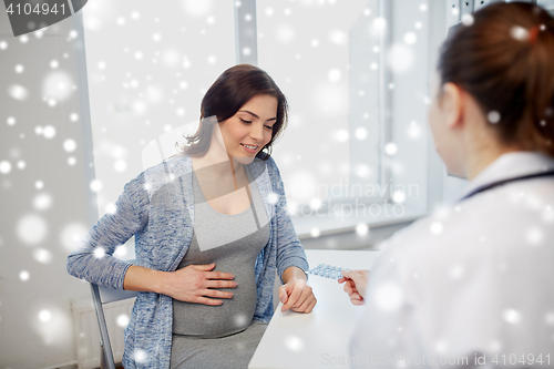 Image of gynecologist doctor and pregnant woman at hospital