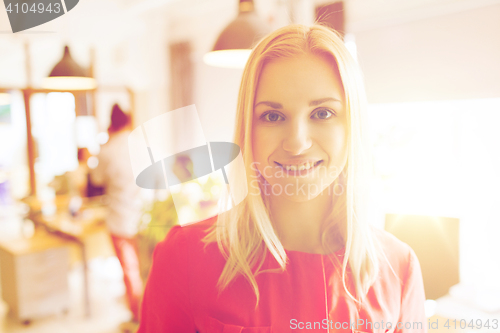 Image of happy creative woman at office or bureau