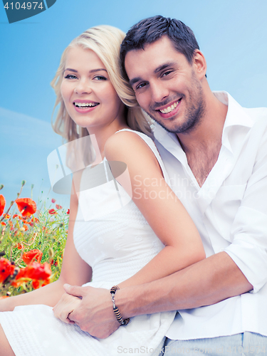Image of happy couple having fun over poppy flowers field