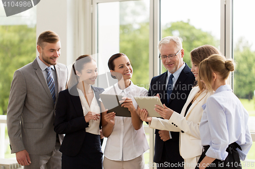 Image of business people with tablet pc computers at office