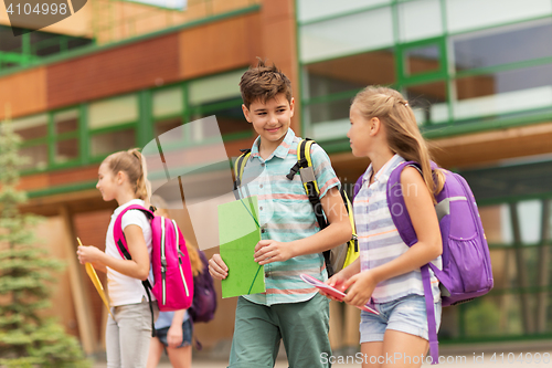 Image of group of happy elementary school students walking