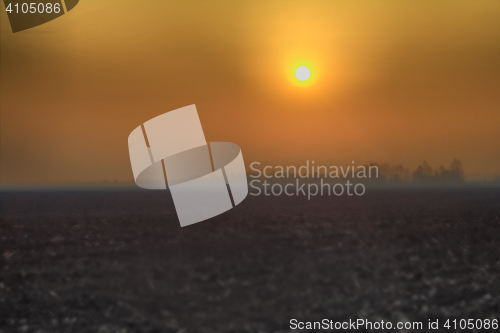 Image of Autumn field in  light of  sunrise