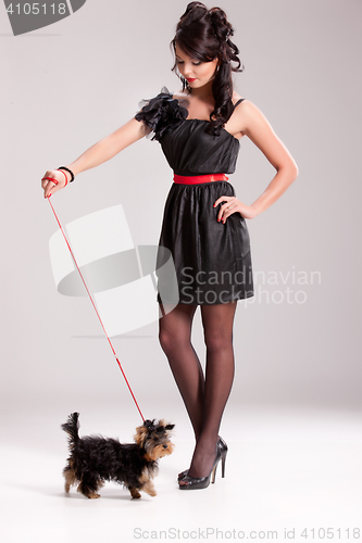 Image of Young Woman With A Little Dog