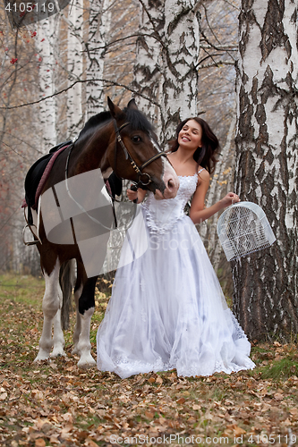 Image of Young Woman And Horse