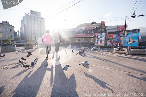 Image of young  couple jogging