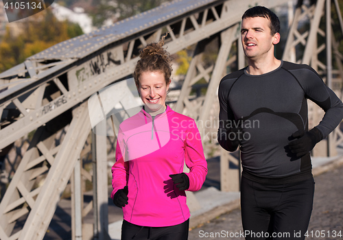 Image of young  couple jogging