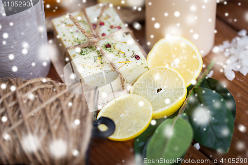 Image of natural soap and candles on wood