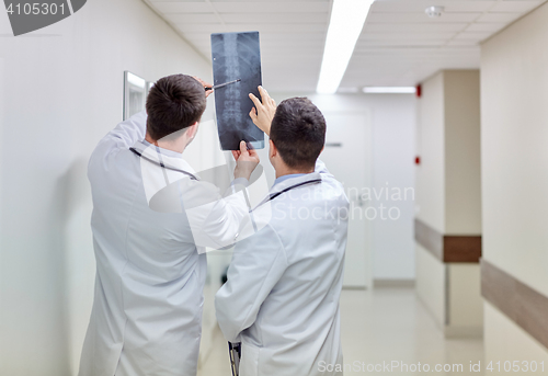 Image of medics with spine x-ray scan at hospital