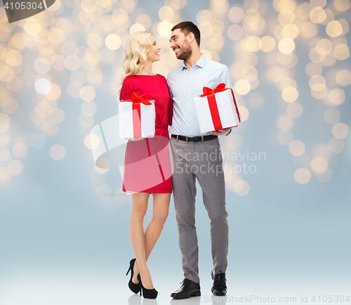 Image of happy couple with gift boxes