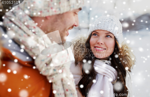 Image of happy couple walking over winter background