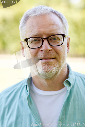 Image of close up of senior man in glasses outdoors