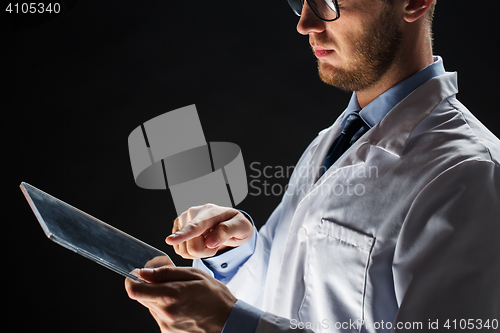 Image of close up of doctor or scientist with tablet pc