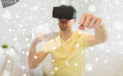 Image of young man in virtual reality headset or 3d glasses