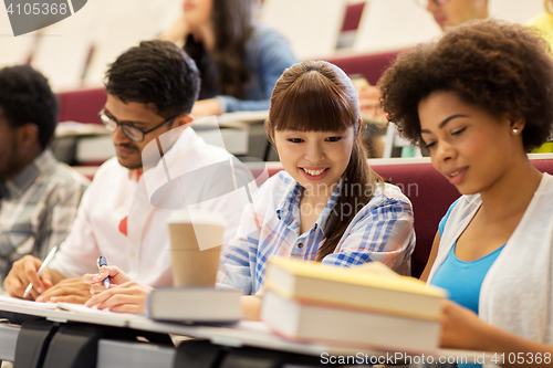 Image of group of international students talking on lecture