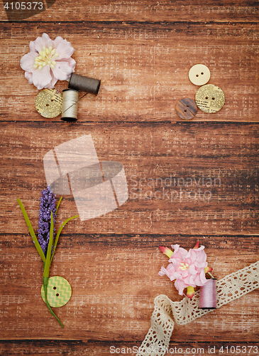 Image of Lace and thread on wooden background