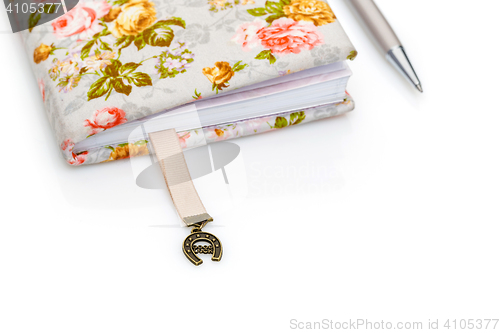 Image of Handmade notebook fragment with horseshoe bookmark