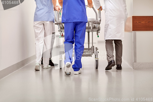 Image of medics carrying hospital gurney to emergency room